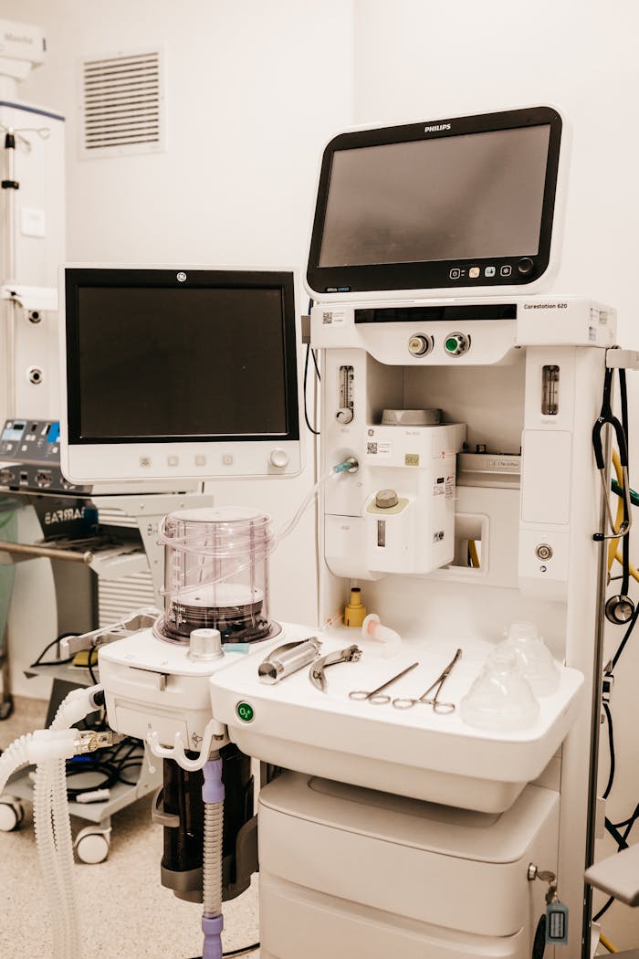 services-01 High-tech medical equipment setup in a hospital room, featuring monitors and surgical tools.
