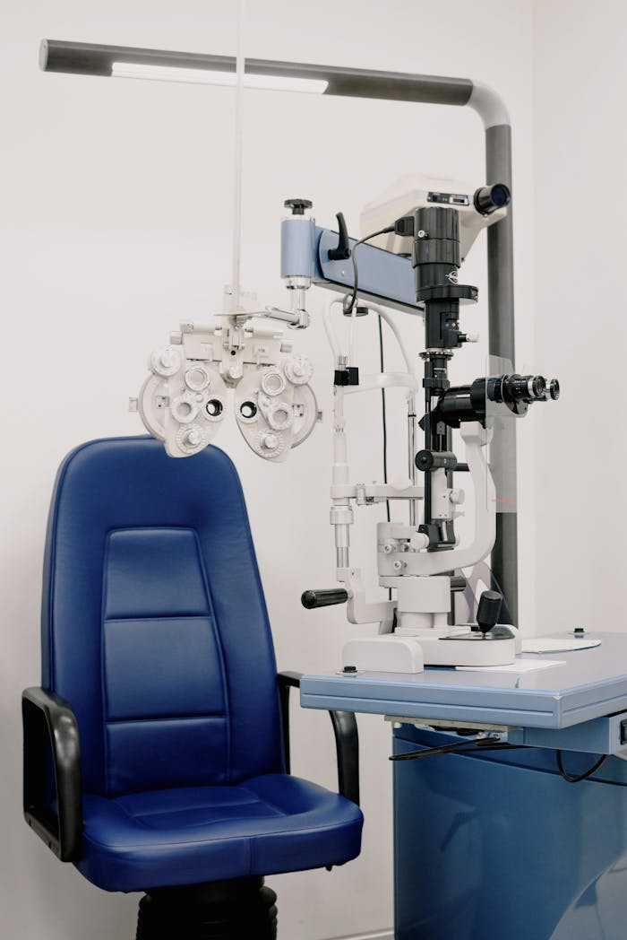 services-02 Interior of modern medical office equipped with chair and phoropter for treatment and checking eyesight