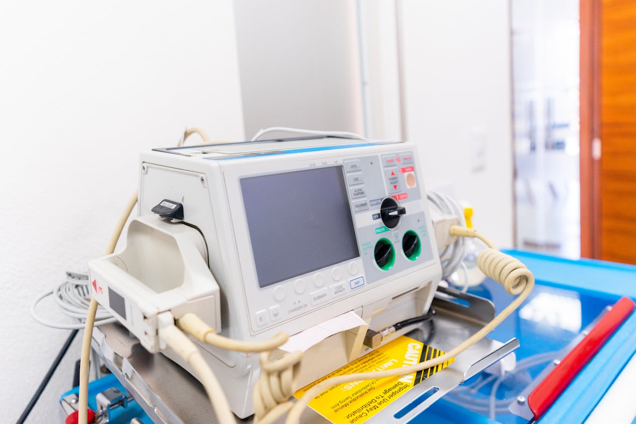 about-01 High-resolution image of a modern defibrillator in a hospital environment.